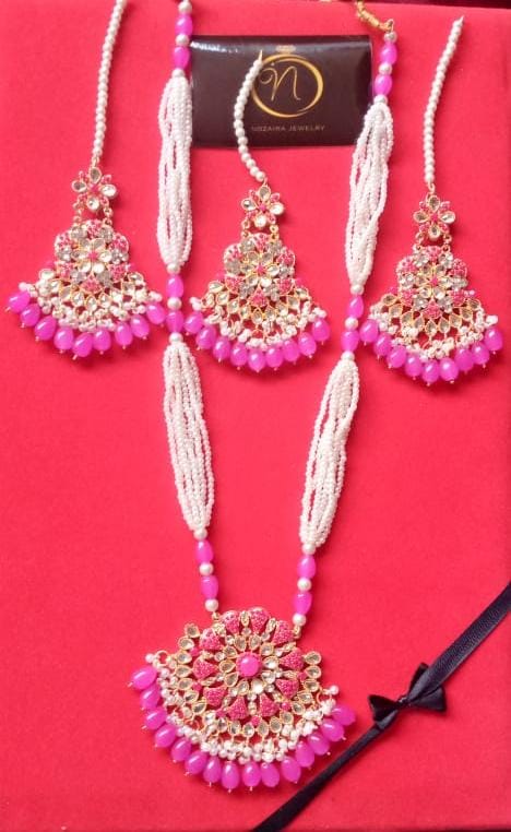 Pink and white beaded jewellery set by Nozaira